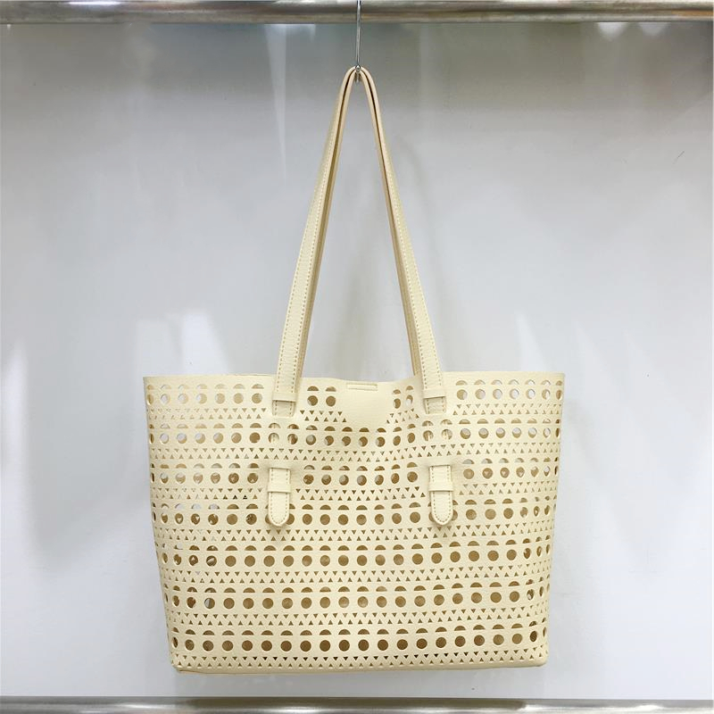 Elegant Hollow Carved Tote Bag - High-End Large Capacity Handbag with Detachable Pouch for Spring/Summer Fashion Elegant Hollow Carved Tote Bag - High-End Large Capacity Handbag with Detachable Pouch for Spring/Summer Fashion