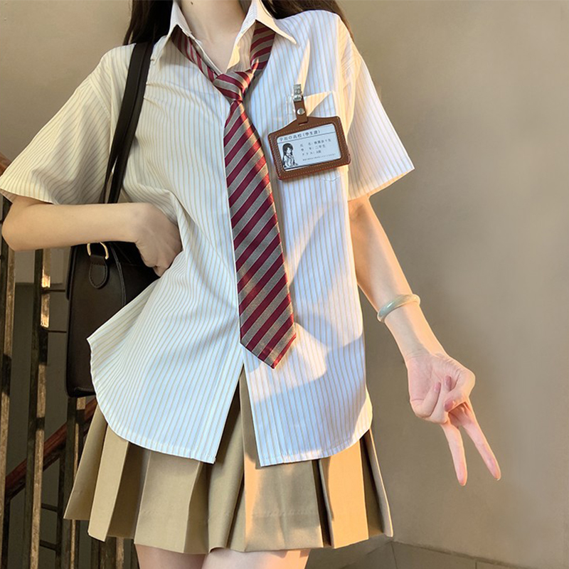 Four-Piece JK Uniform Set for Women: Striped Long Sleeve Shirt, Loose Fit, Pleated Skirt - Trendy 2024 Autumn Style Four-Piece JK Uniform Set for Women: Striped Long Sleeve Shirt, Loose Fit, Pleated Skirt - Trendy 2024 Autumn Style