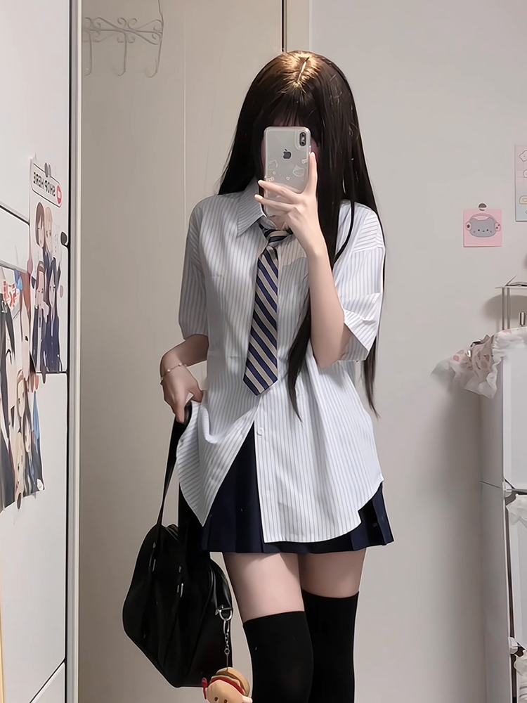 Four-Piece JK Uniform Set for Women: Striped Long Sleeve Shirt, Loose Fit, Pleated Skirt - Trendy 2024 Autumn Style Four-Piece JK Uniform Set for Women: Striped Long Sleeve Shirt, Loose Fit, Pleated Skirt - Trendy 2024 Autumn Style
