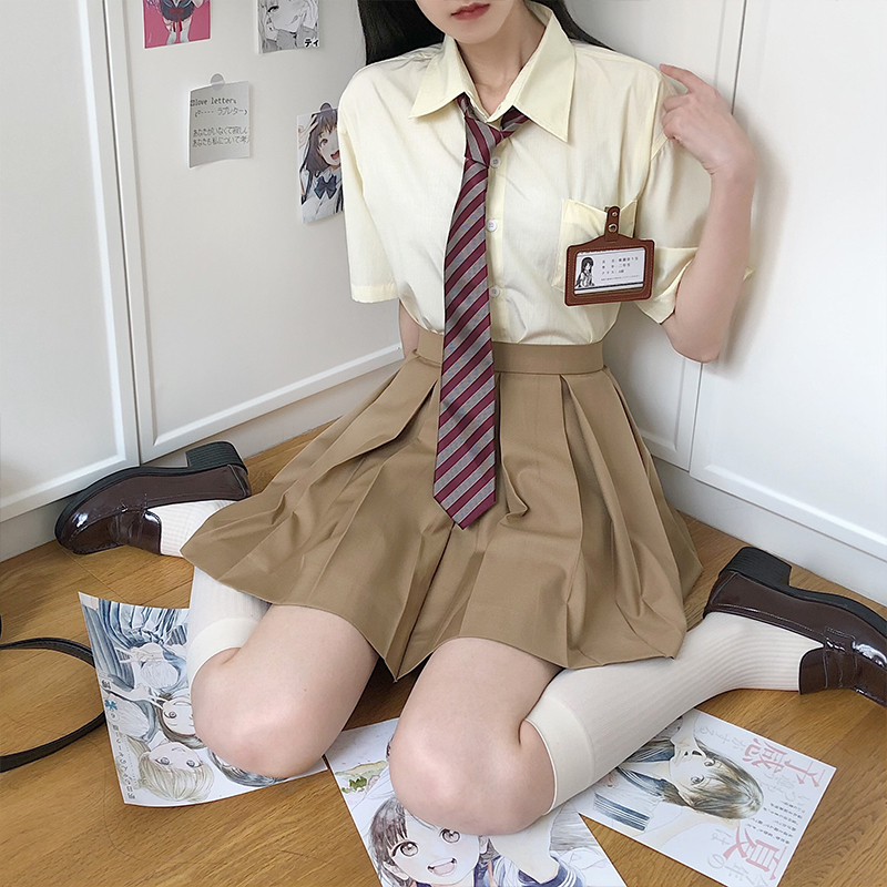 High-Waisted Pleated JK Uniform Skirt in Plaid - Solid Color Basic Style, Authentic 90s-Inspired Pudding Bear Aesthetic High-Waisted Pleated JK Uniform Skirt in Plaid - Solid Color Basic Style, Authentic 90s-Inspired Pudding Bear Aesthetic