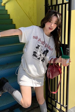 Plus-Size Cartoon Print Drawstring Short-Sleeve T-Shirt and High-Waisted Skirt Two-Piece Set - Trendy Summer Outfit for Women