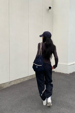 Rebellious Aesthetics Slanted Buckle Design Tencel Tee - Nonconformist Style, 90s Inspired Fashion Top